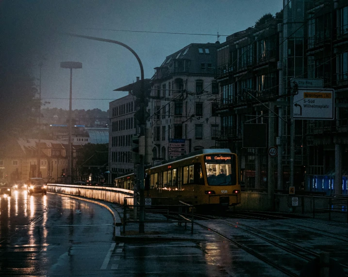 a city street in the rain at night