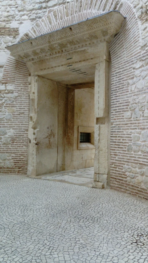 the doorway to a very old and narrow building