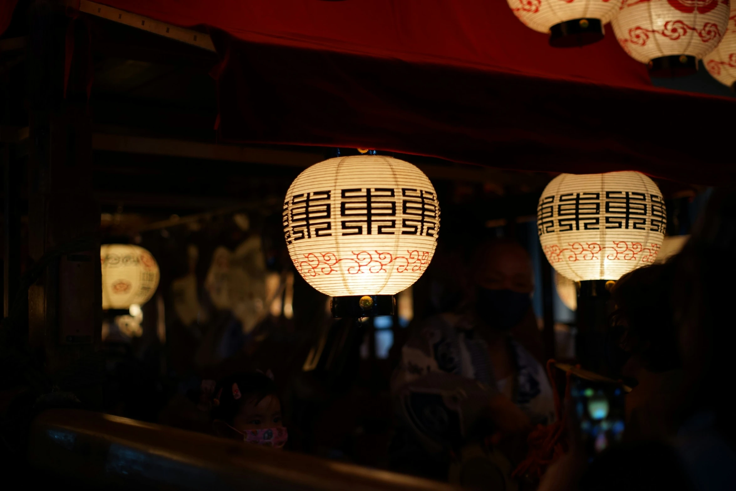 a bunch of lanterns lit up in the dark