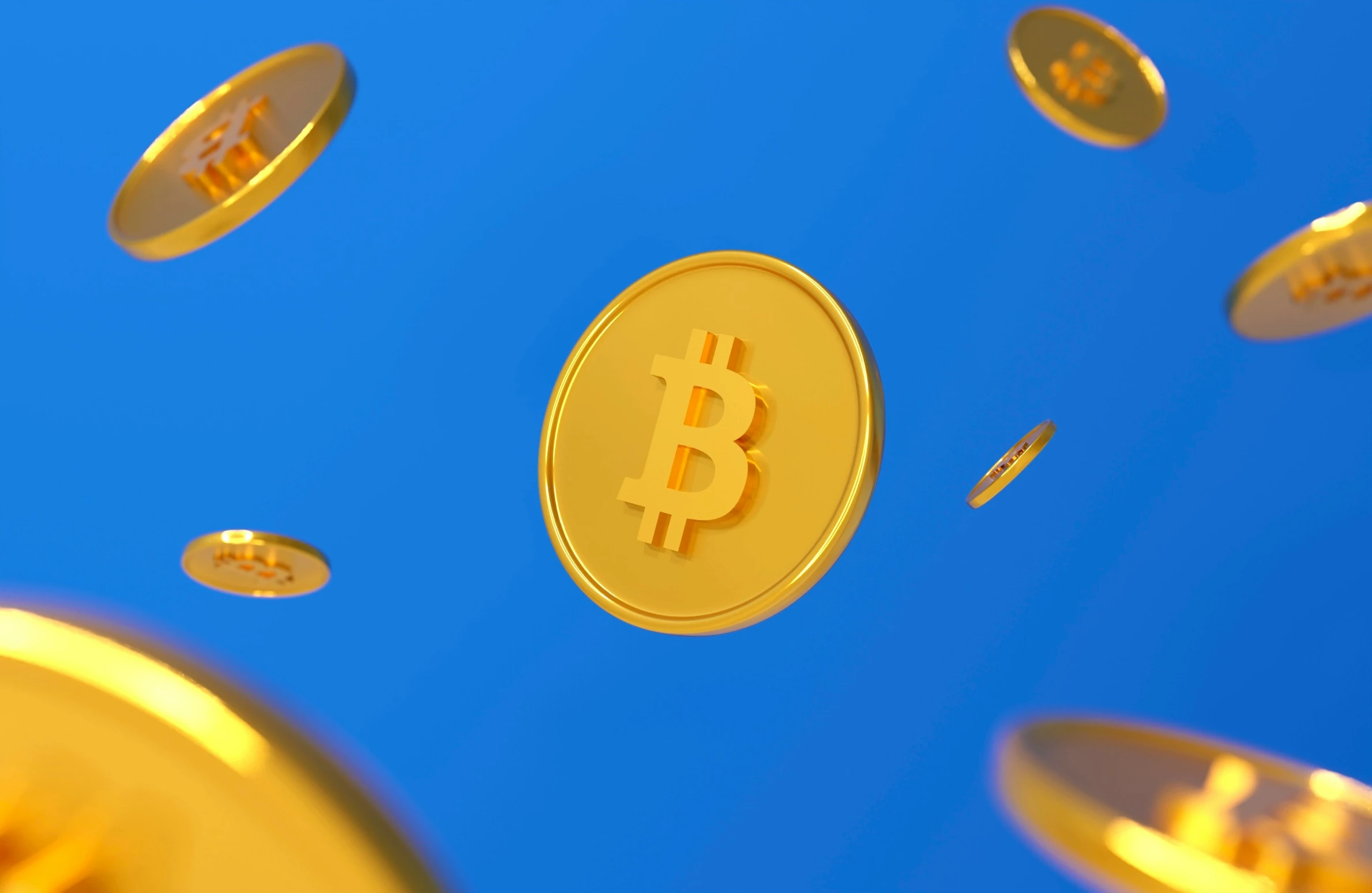 golden coins flying in the sky with a bitcoin symbol on top