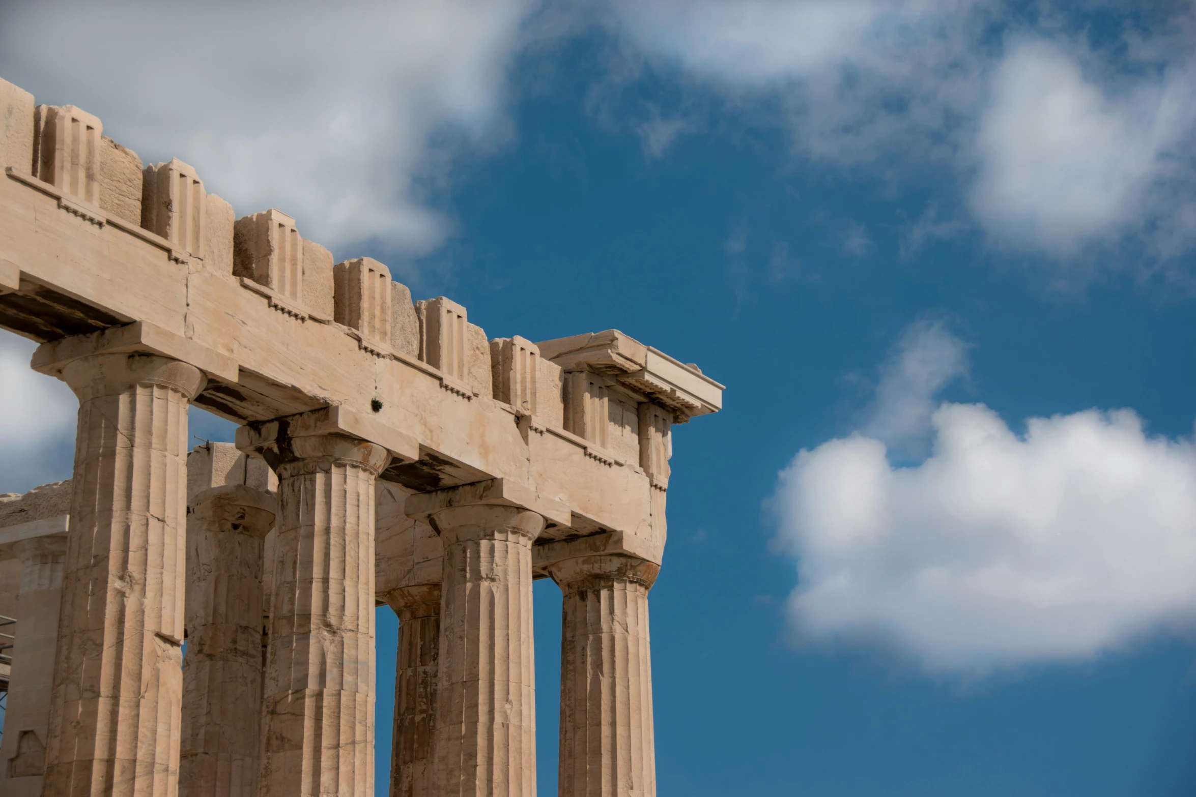 a stone structure with columns in the middle