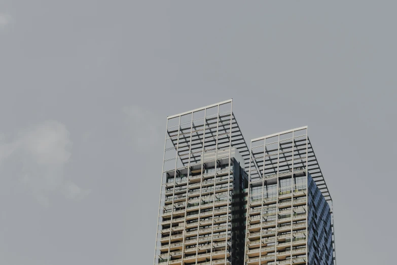 two buildings that are near each other in the sky