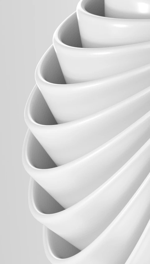 a close up of a large white vase with wavy forms