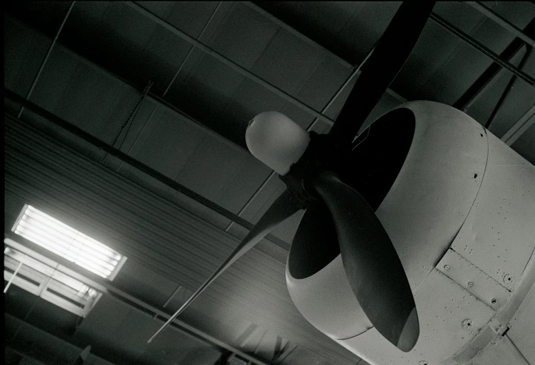 this is a propeller on an airplane in the hanger