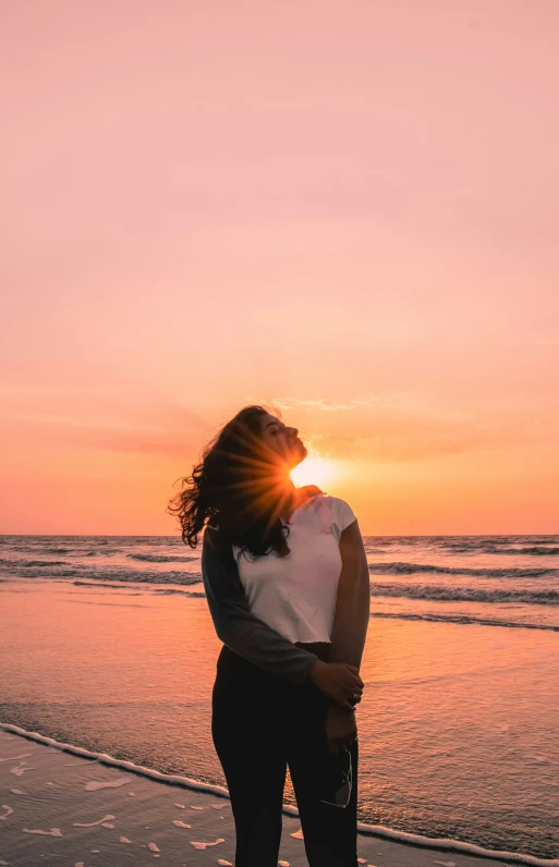 an image of woman emcing her boyfriend on the beach