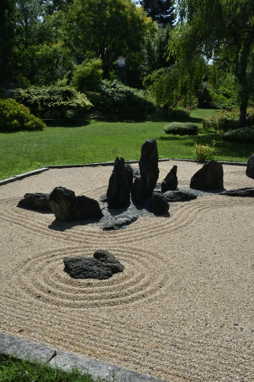 a circular garden area with rocks in it