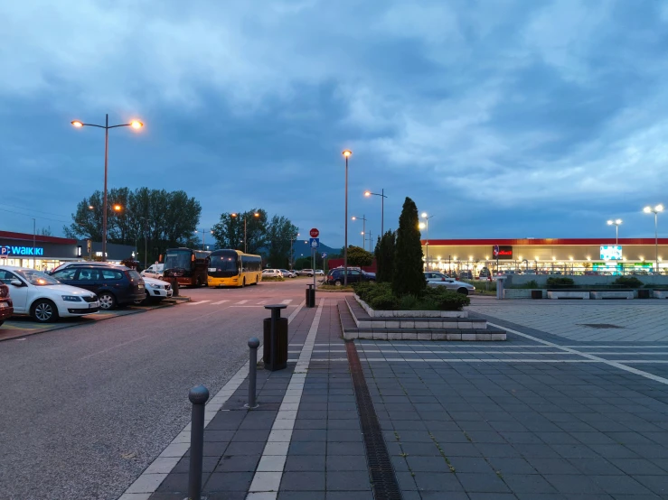 a street lined with parking spaces and parked cars