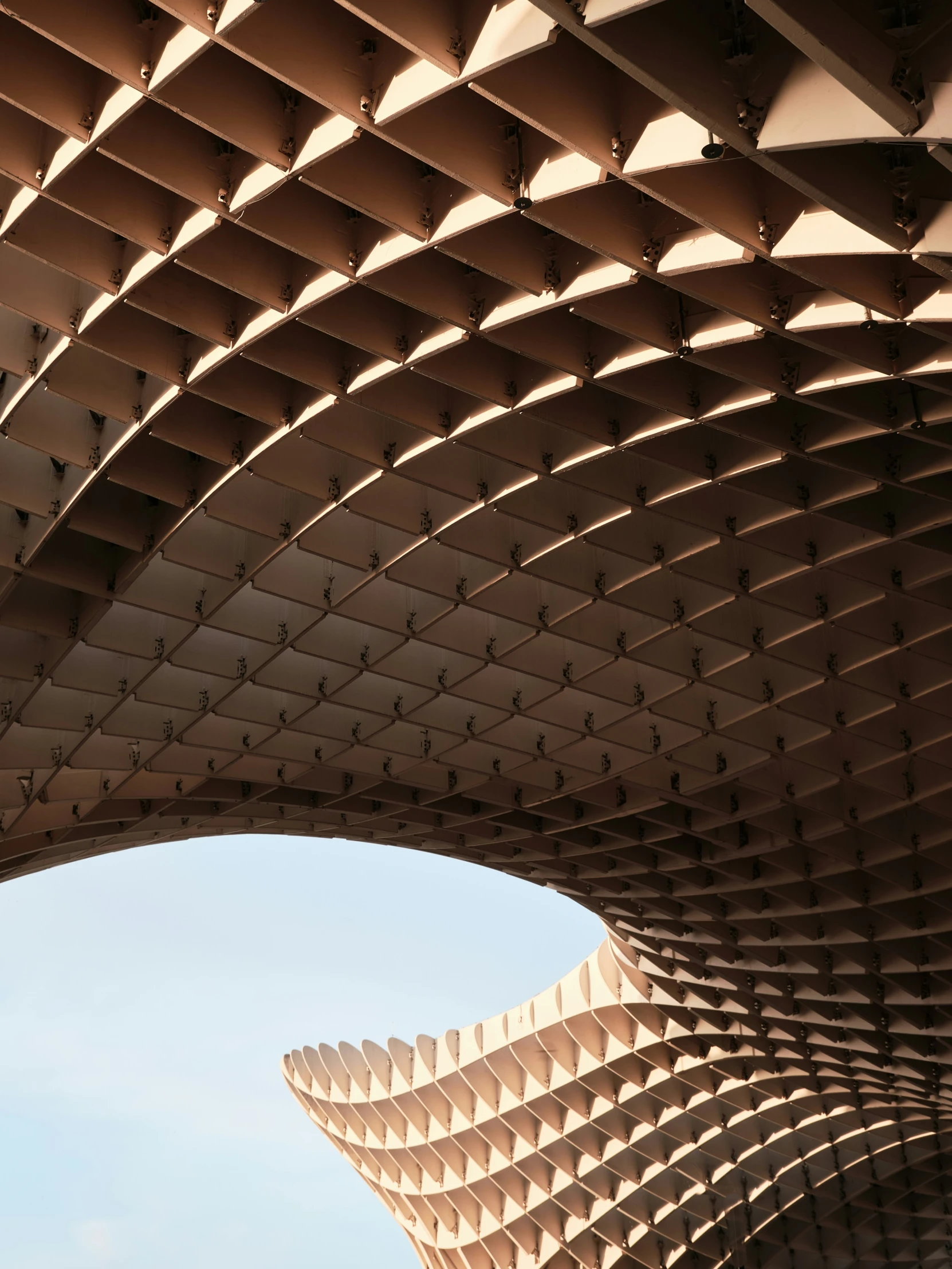 a close up view of a circular structure with a sky background