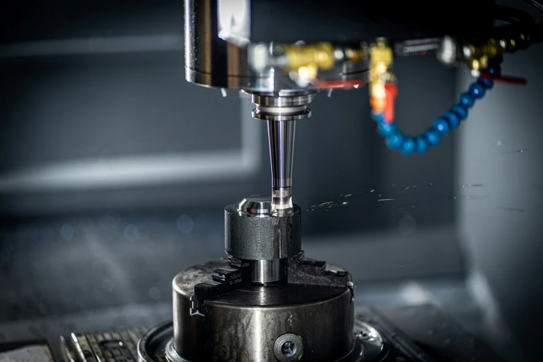 a milling machine working on a cylinder