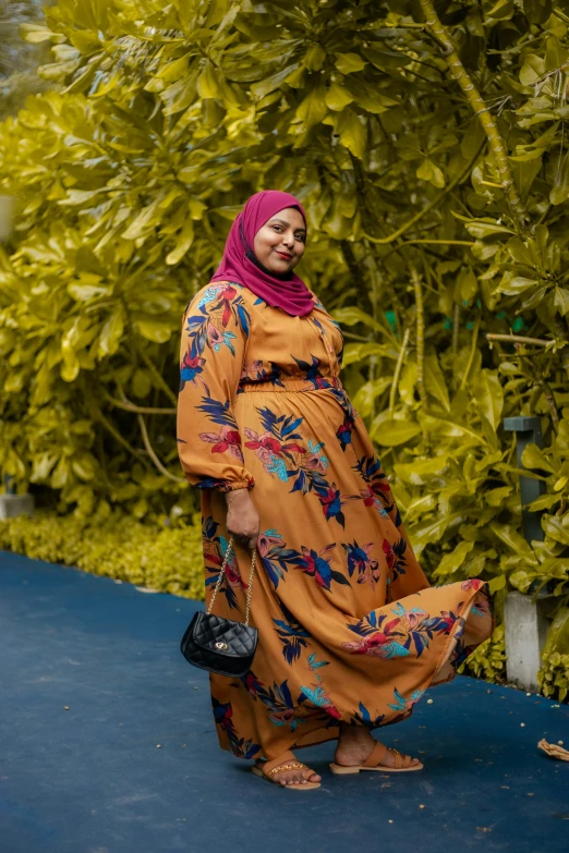 a woman standing in front of a plant