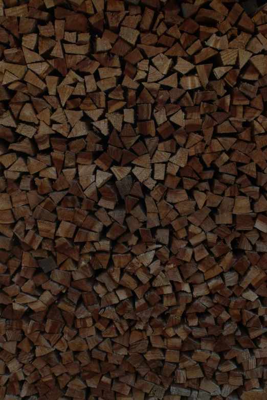 a brown background with wood planks piled and chopped up