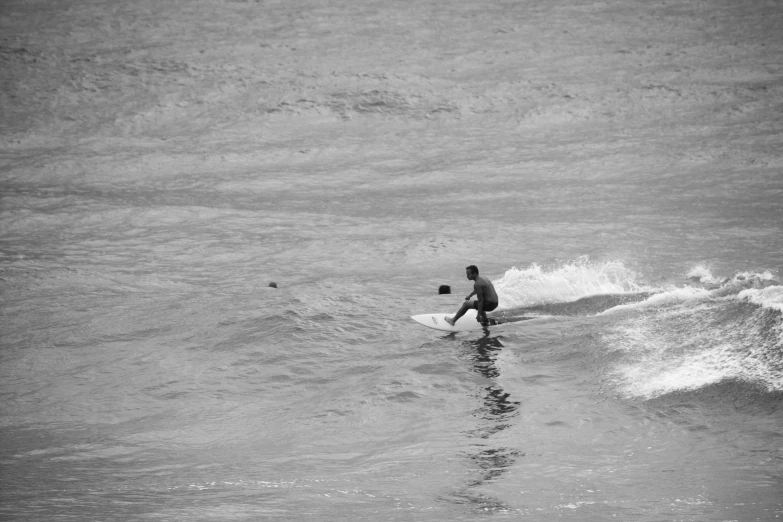 a person standing on a surfboard in the ocean