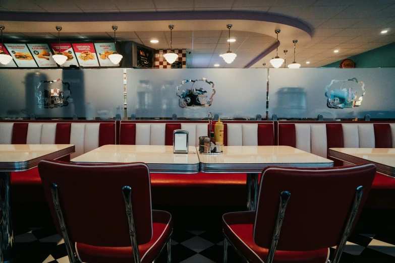 an image of a dining room setting with red chairs