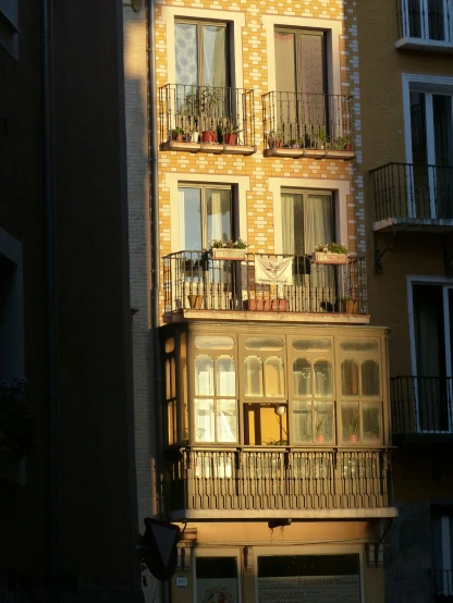 a building with a balcony and multiple balconies