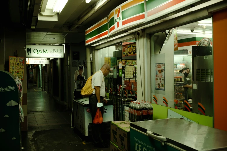 an old man is filling up his cart at the convenience store