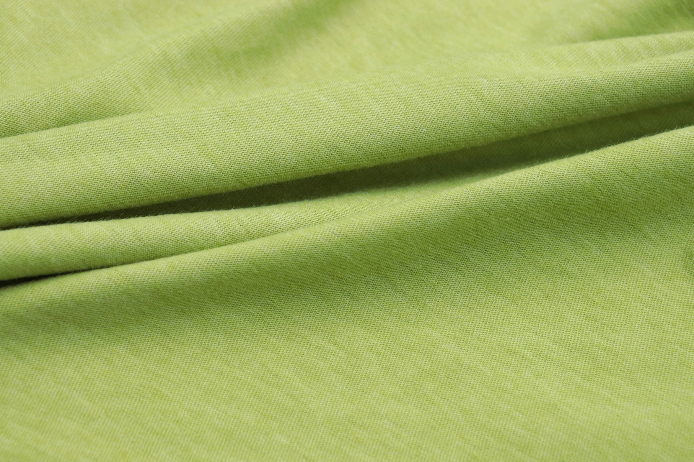 a closeup image of a green background or fabric