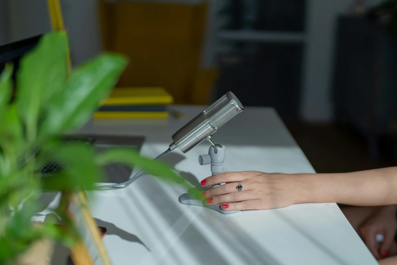 a woman that is sitting down with a hairdryer