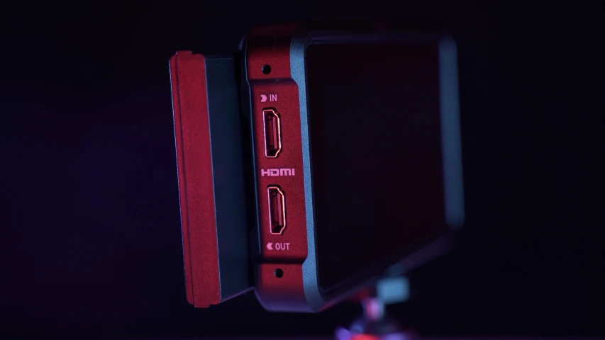 an electronic device with red light in the background