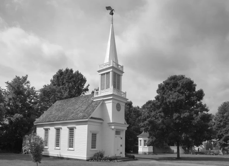 the church is white and has a steeple