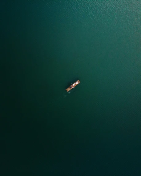 a boat in the water with only one rowboat