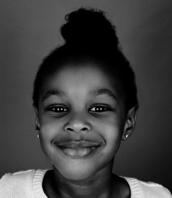 black and white pograph of a smiling young woman