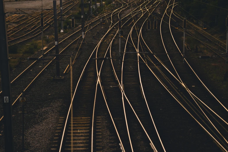 multiple railroad tracks are shown with their lights on