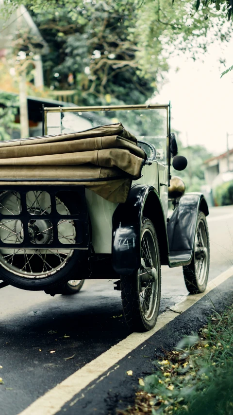 a motorcycle with two front wheels and a covered passenger cart