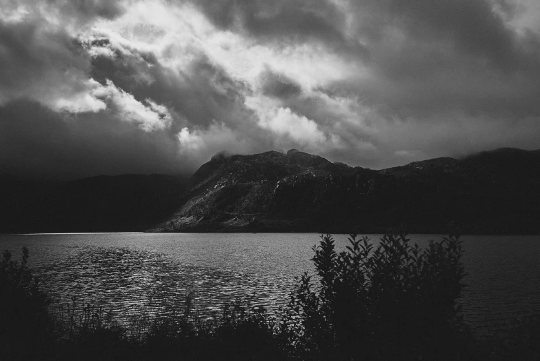 a beautiful lake surrounded by mountains and trees