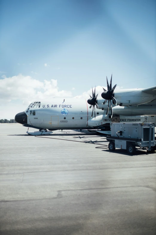 a parked plane on top of an airport runway