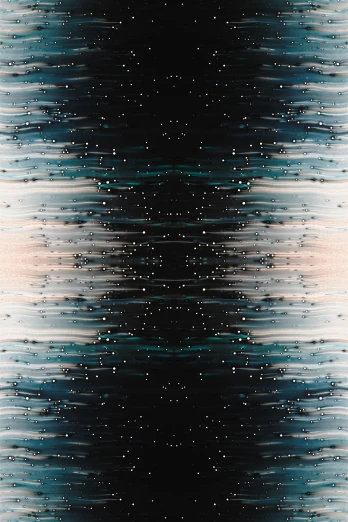 the background image shows blurry lines and circles in shades of grey, blue, black and gold