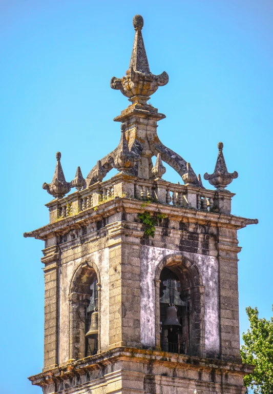 an old tower has a clock on the top