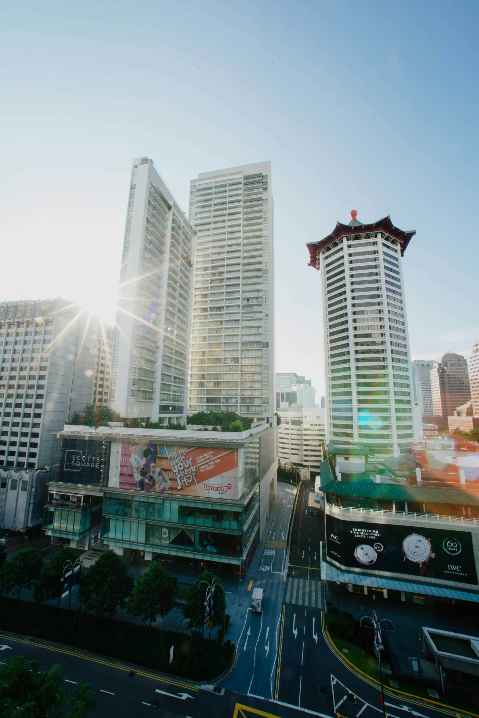 the large buildings and businesses near the highway are all very tall