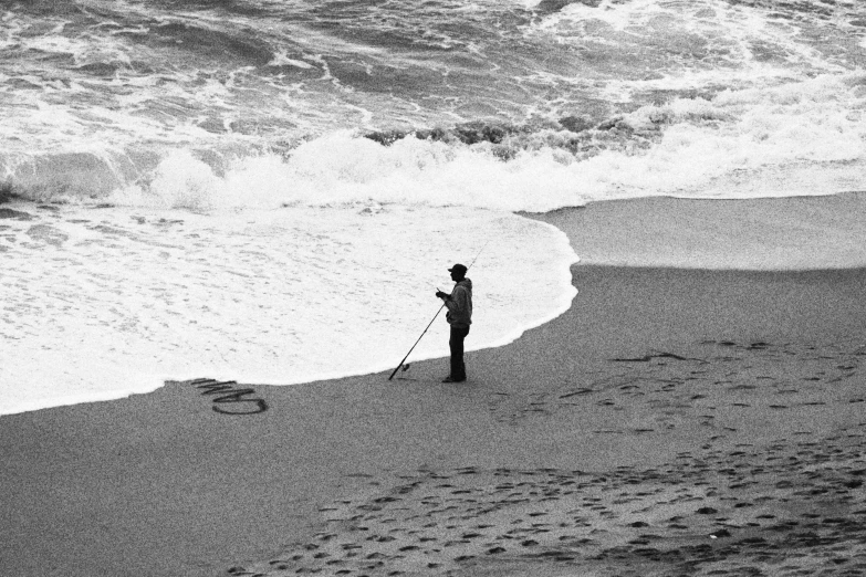 a man standing on top of a sandy beach