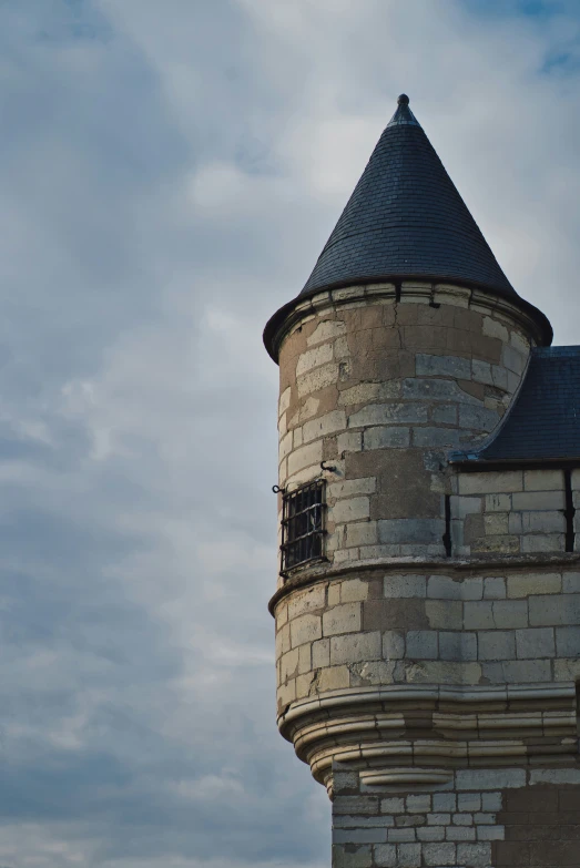 this is an image of a tower with a weather vein