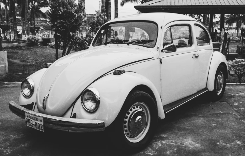 a black and white po of an old volkswagen beetle