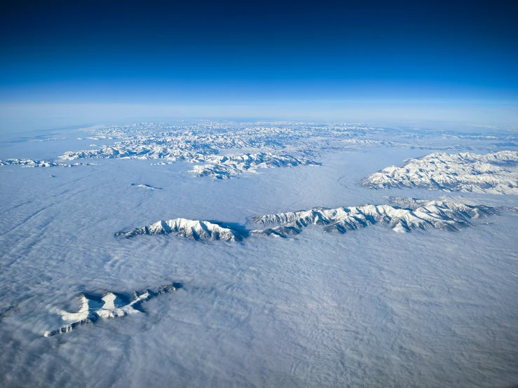 a large mountain covered in lots of snow