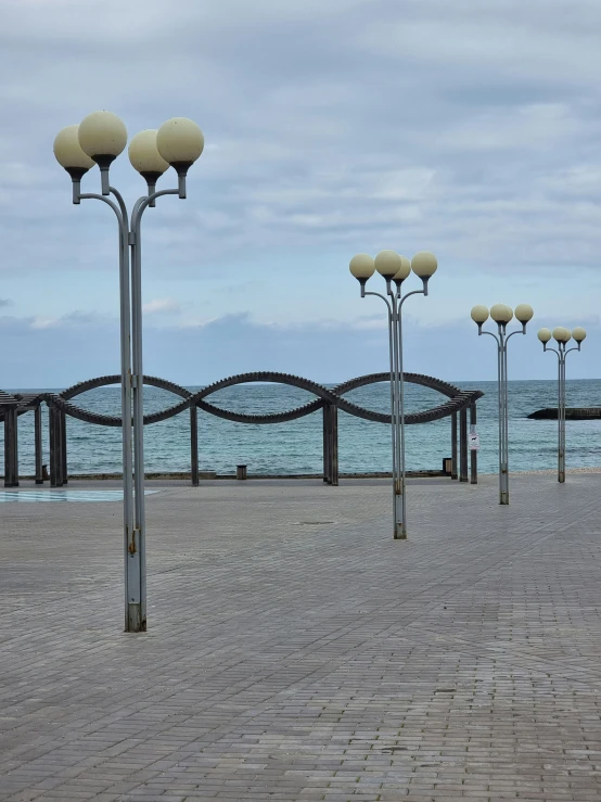 some decorative lamp posts that are standing on the ground