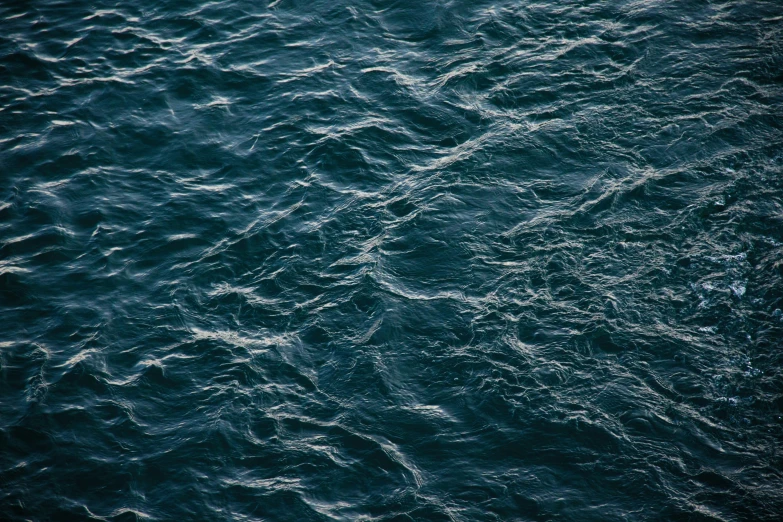 the surface of the water has been drawn by small waves