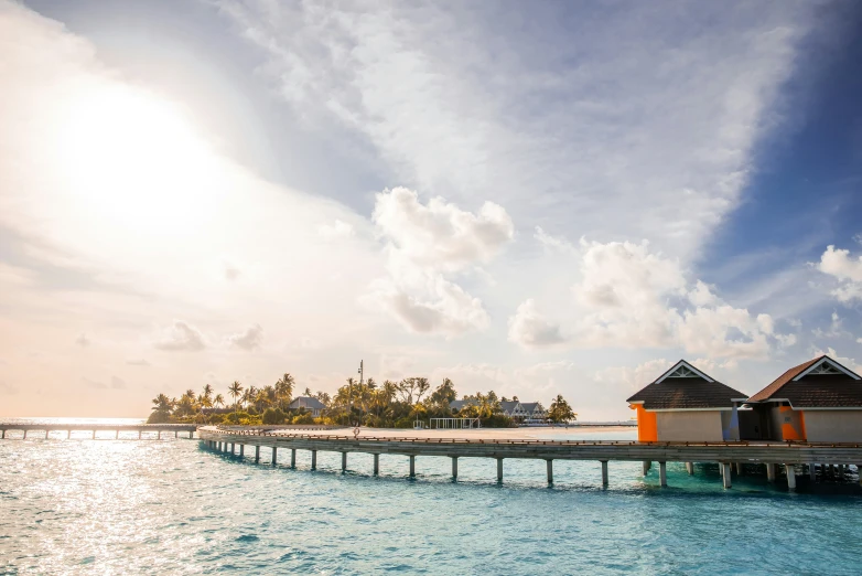 a pier that is surrounded by small buildings