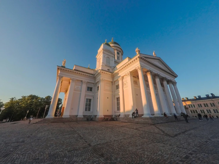 white building with columns in the middle of it