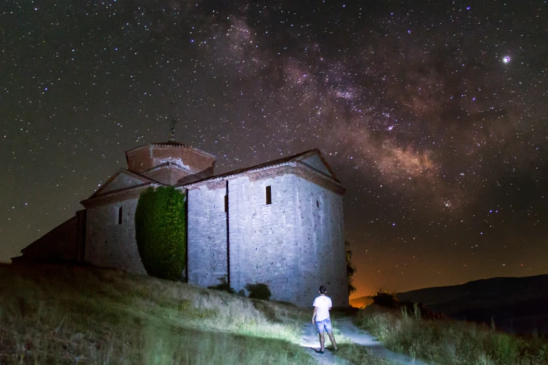 the people walk up the steep hill to the light house