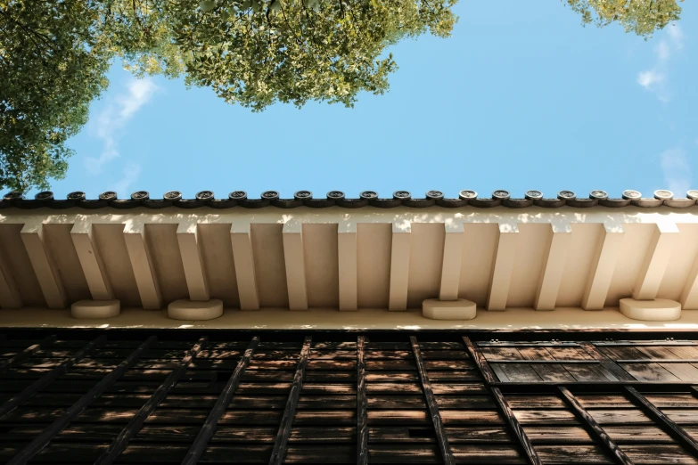 an architectural roof with small pots of planters on each