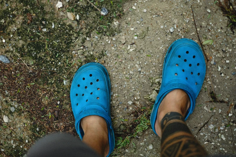 a close up of someone's feet on the ground