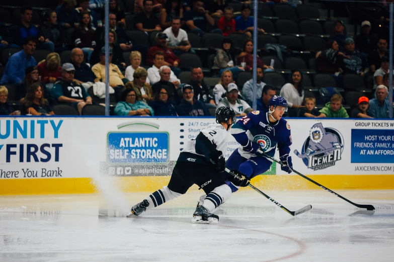 the hockey players are competing for position on the ice