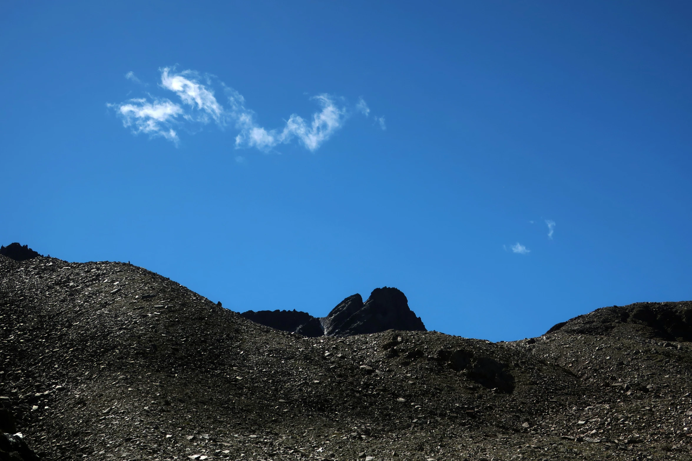 the view of clouds in the sky and some mountains