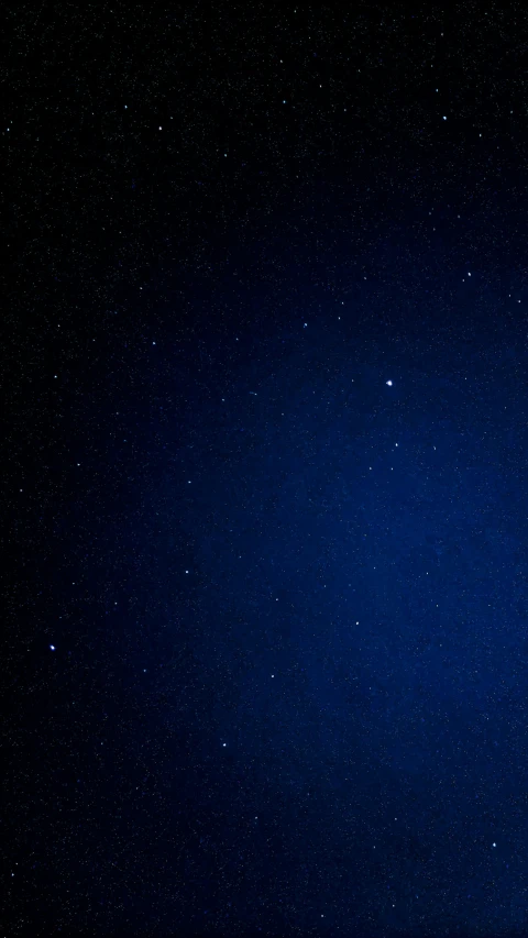 a night time sky with the moon and stars