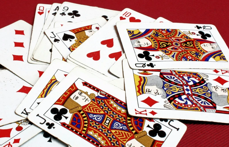 a stack of playing cards with one card being taken out