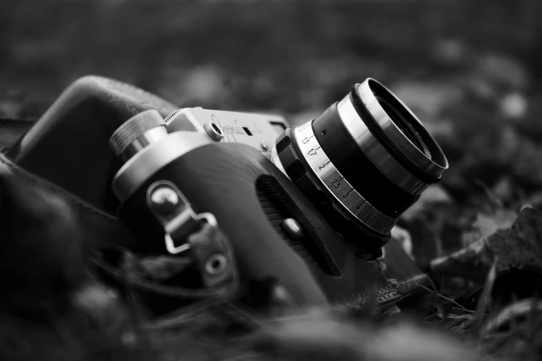a close up of a camera lens and a camera strap