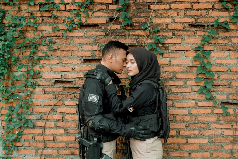 an image of couple standing close together with backpack