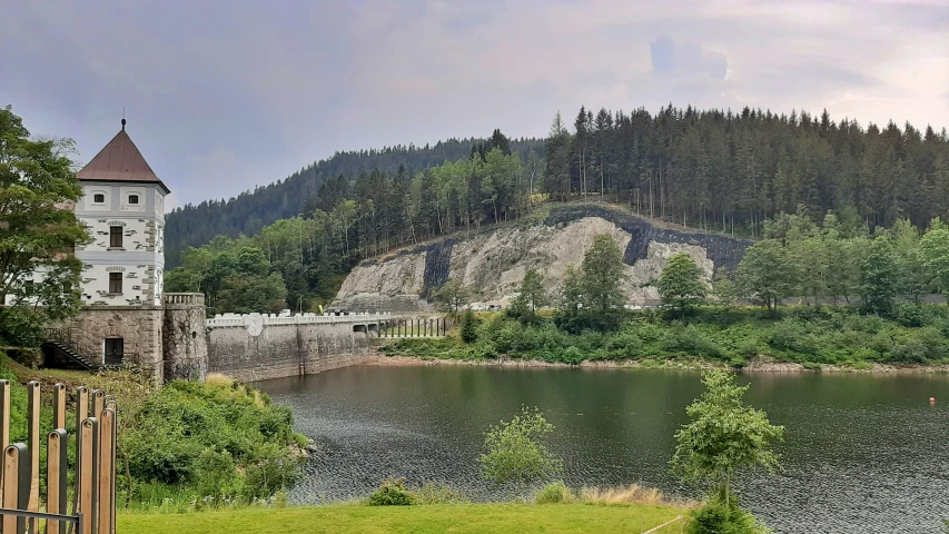 a very big pretty castle by a body of water